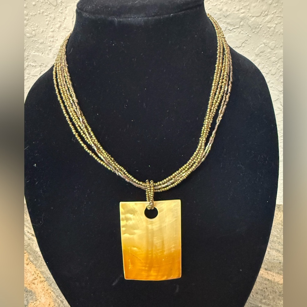 Bugle bead necklace with shell pendant